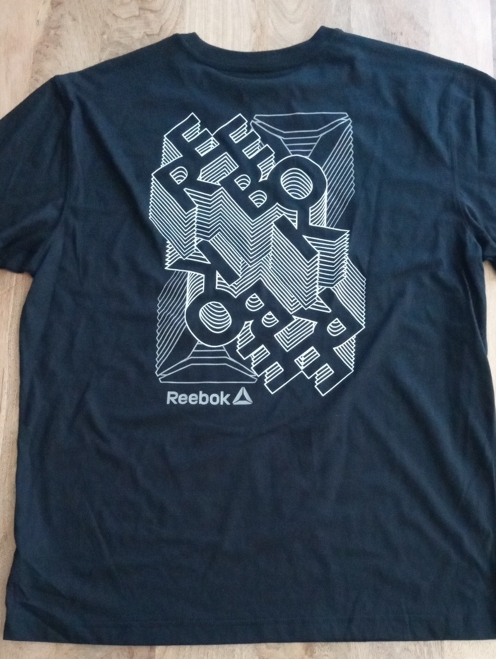 Reebok Men’s Black Tee with White Geometric Logo